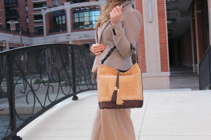 Julia cork hobo handbag in natural and brown colour with gold brassware. With a strap so that this bag can be worn as a crossbody.