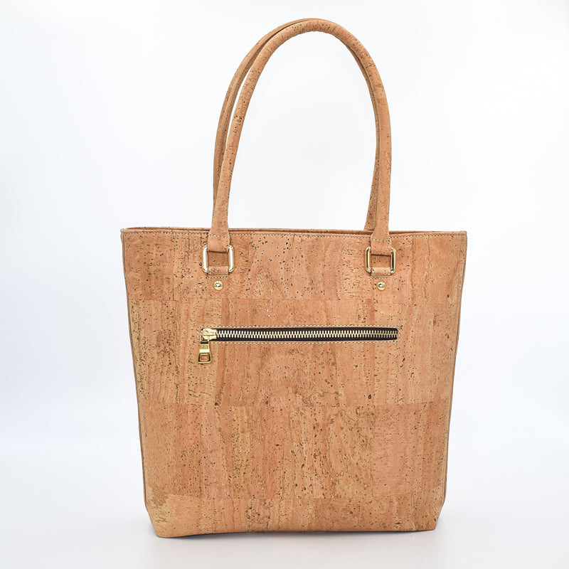 Marge medium tote bag in natural colour. Strap included which allow the bad to be a cross body as well.  Made from cork leather and is vegan and peta approved.