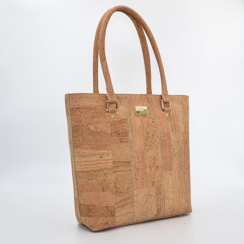 Marge medium tote bag in natural colour. Strap included which allow the bad to be a cross body as well.  Made from cork leather and is vegan and peta approved.
