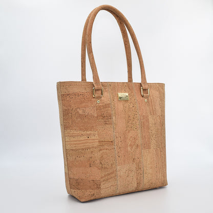Marge medium tote bag in natural colour. Strap included which allow the bad to be a cross body as well.  Made from cork leather and is vegan and peta approved.
