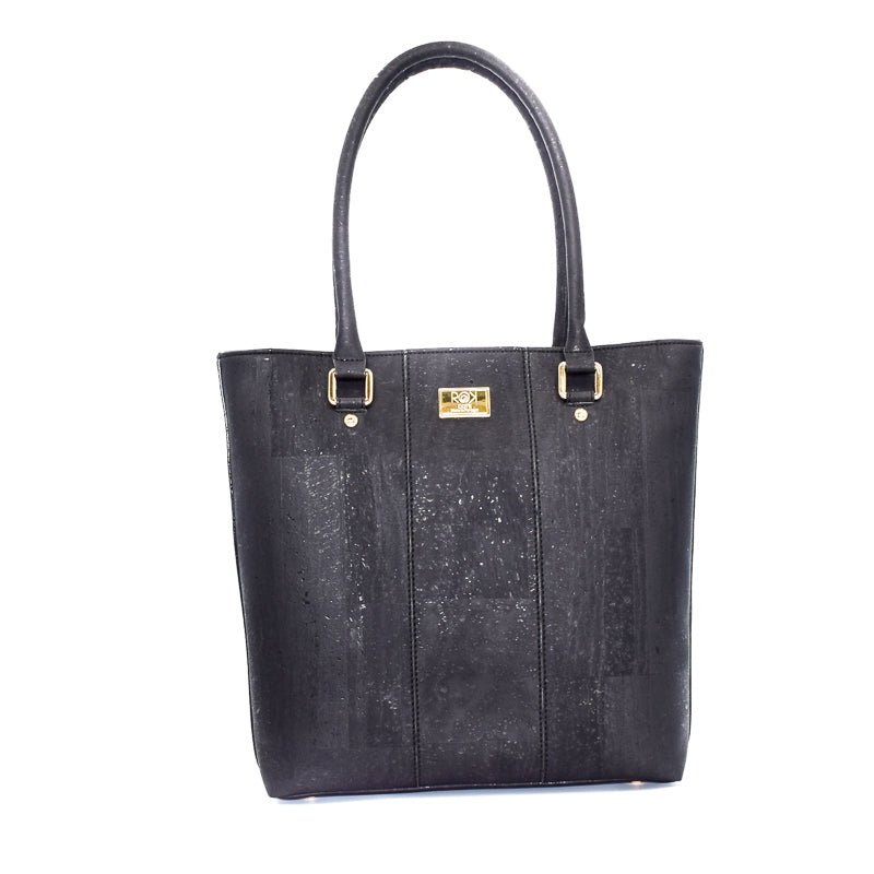 Marge medium tote bag in black colour. Strap included which allow the bad to be a cross body as well. Made from cork leather and is vegan and peta approved.