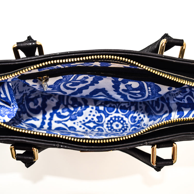 Marge medium tote bag in black colour. Strap included which allow the bad to be a cross body as well. Made from cork leather and is vegan and peta approved.