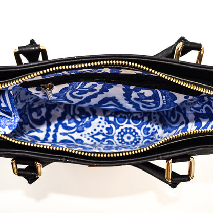 Marge medium tote bag in black colour. Strap included which allow the bad to be a cross body as well. Made from cork leather and is vegan and peta approved.