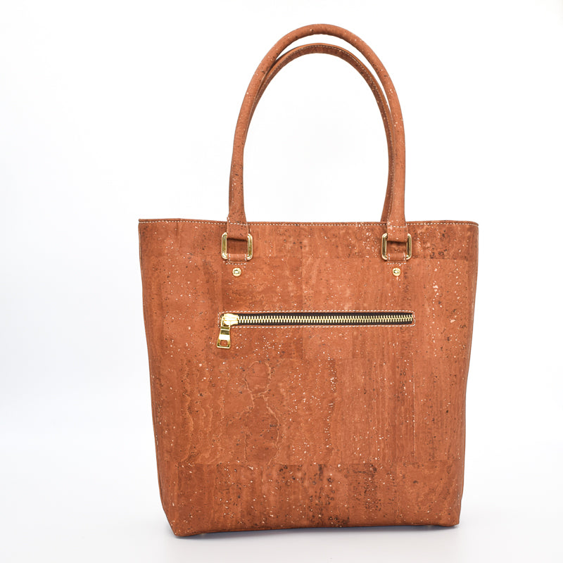 Marge medium tote bag in salted caramel colour. Strap included which allow the bad to be a cross body as well. Made from cork leather and is vegan and peta approved.