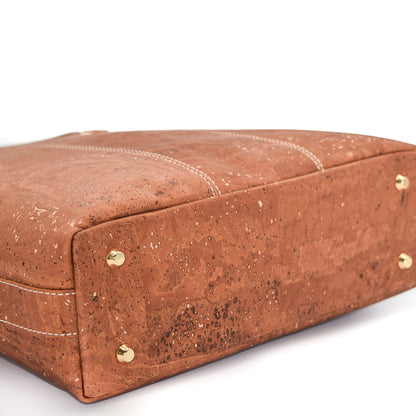 Marge medium tote bag in salted caramel colour. Strap included which allow the bad to be a cross body as well. Made from cork leather and is vegan and peta approved.