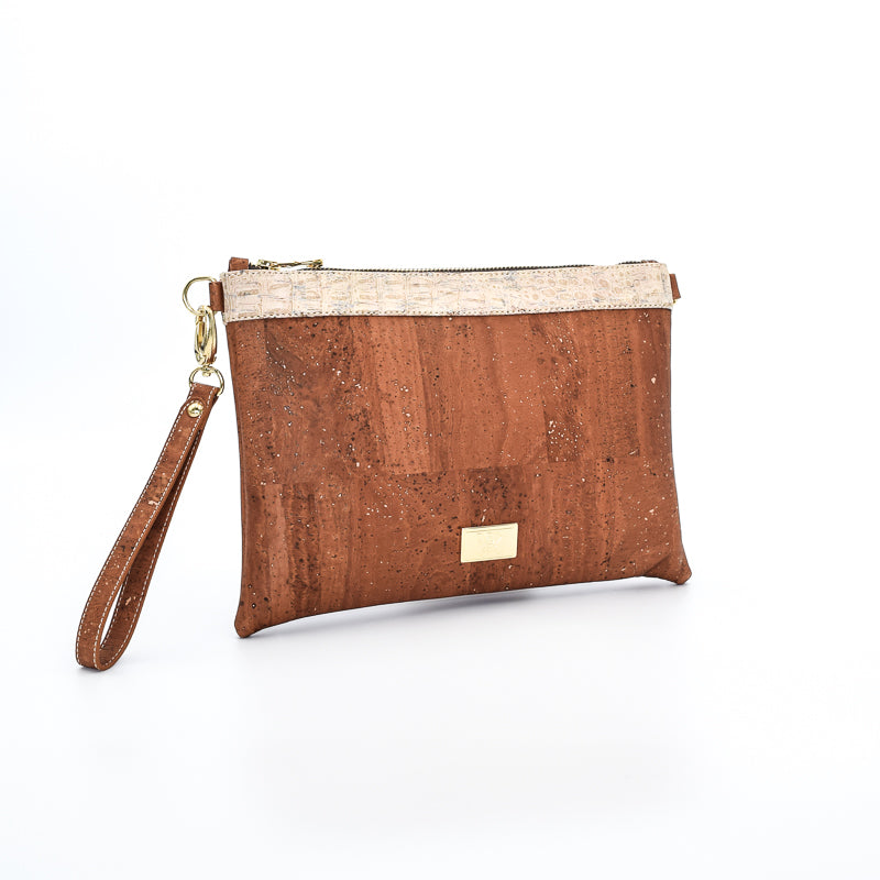 The Medlyn vegan cork leather clutch bag in Salted Caramel. Comes with a wrist strap and shoulder strap so that it can also be a cross body bag. Cruelty free and peta approved.