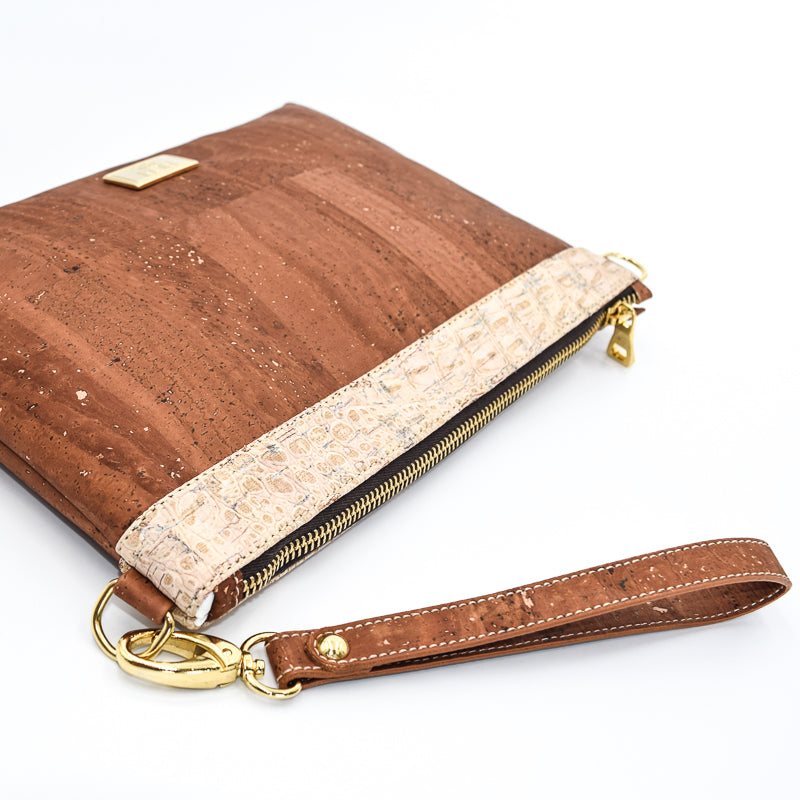 The Medlyn vegan cork leather clutch bag in Salted Caramel. Comes with a wrist strap and shoulder strap so that it can also be a cross body bag. Cruelty free and peta approved.
