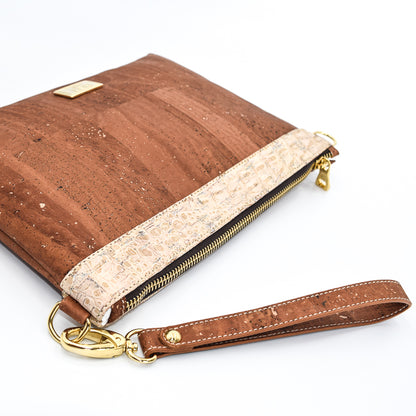 The Medlyn vegan cork leather clutch bag in Salted Caramel. Comes with a wrist strap and shoulder strap so that it can also be a cross body bag. Cruelty free and peta approved.